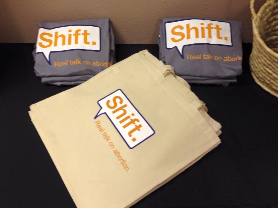 Shift. Real Talk on Abortion. t-shirts and tote bags. Proceeds from these go towards the Whole Woman's Health Stigma Relief Fund!